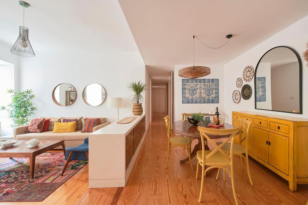 a living room with a couch and a table at Inglesinhos Convento 2 - Cheerful Apartment in Lisbon