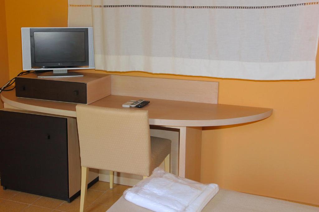 TV a/nebo společenská místnost v ubytování Agriturismo Roccadia
