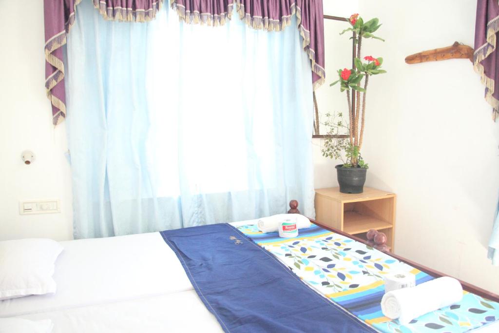Postel nebo postele na pokoji v ubytování DreamCatcher Residency