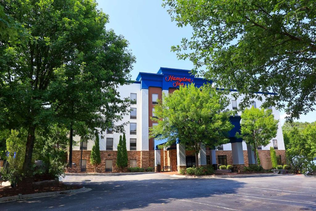a building with a sign on the front of it at Hampton Inn Atlanta-Canton in Canton