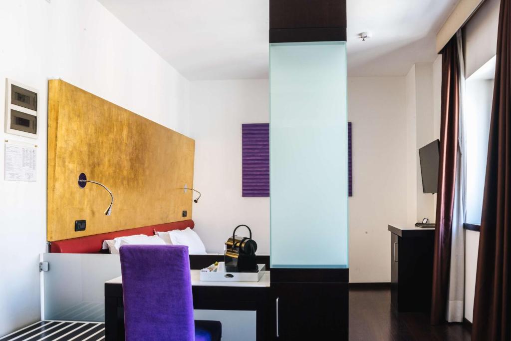 TV a/nebo společenská místnost v ubytování Best Western Hotel Tritone