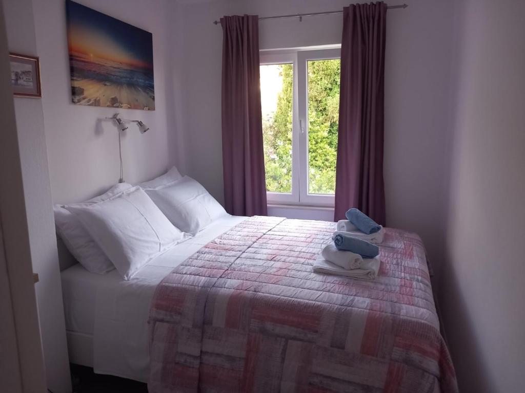 Posteľ alebo postele v izbe v ubytovaní Apartment Blue Pearl
