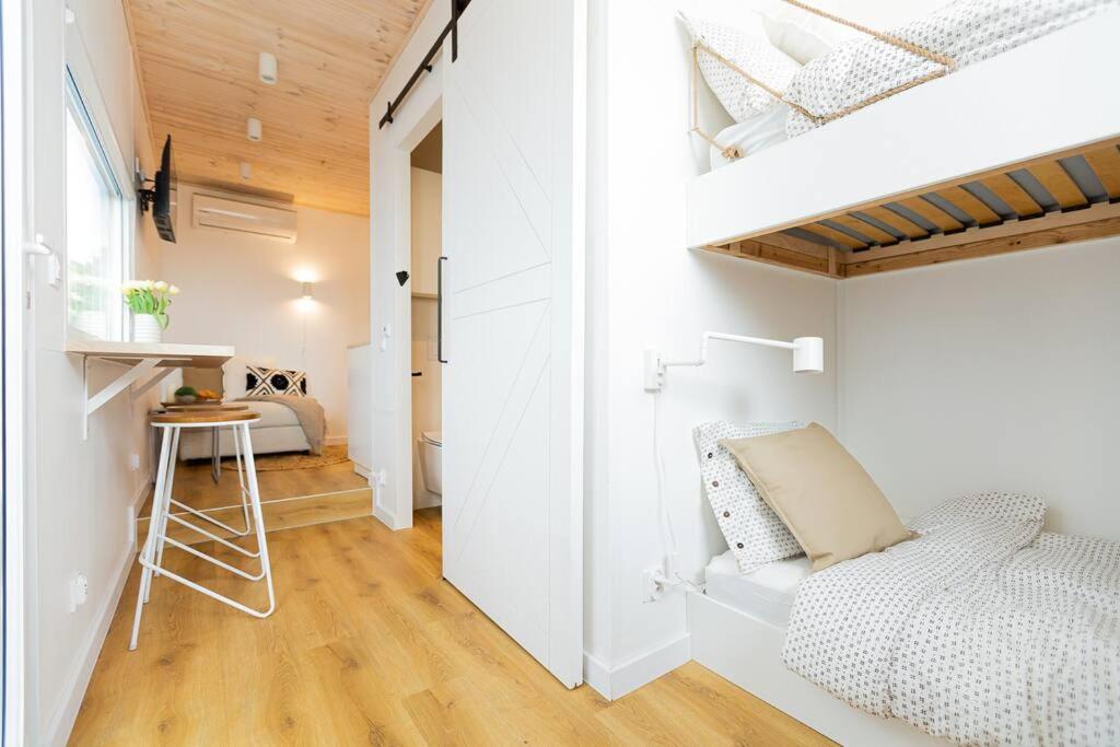 a white bedroom with a bed and a desk at Good Spot Zieleniec Twin Eco 03 in Duszniki Zdrój
