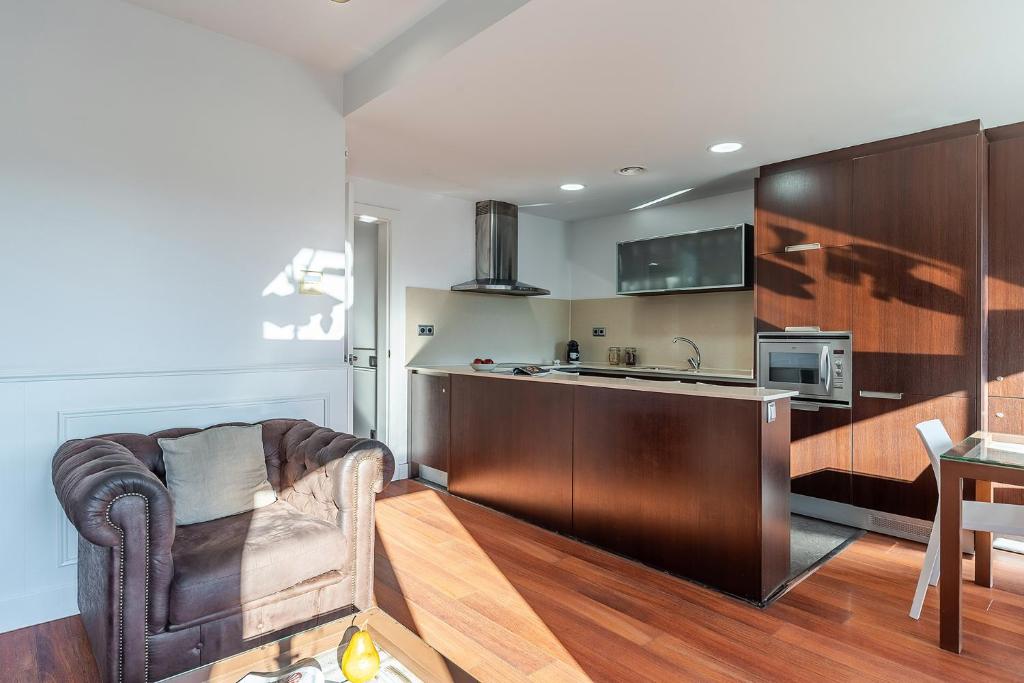 Kuchyň nebo kuchyňský kout v ubytování Enjoybcn Fira Apartment