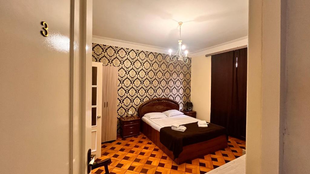 Postel nebo postele na pokoji v ubytování Elross Hotel
