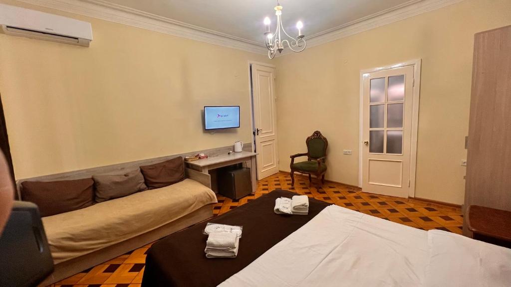 Postel nebo postele na pokoji v ubytování Elross Hotel