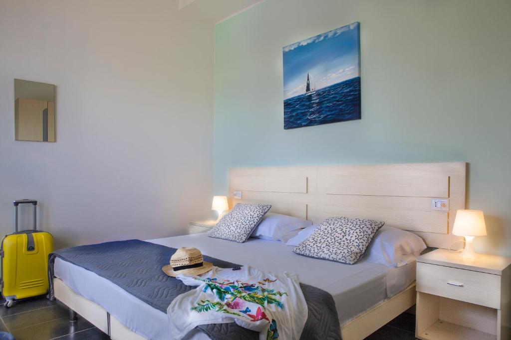 Postel nebo postele na pokoji v ubytování Hotel Spiaggia Marconi