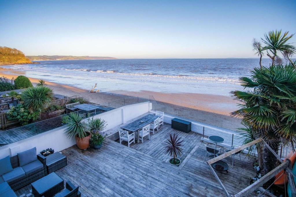 a view of the beach from a balcony at Beachways - 5 Bedroom Holiday Home - Saundersfoot in Saundersfoot
