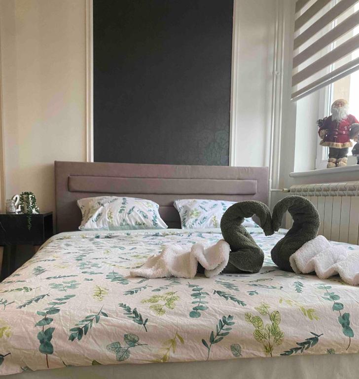 سرير أو أسرّة في غرفة في Apartman Una