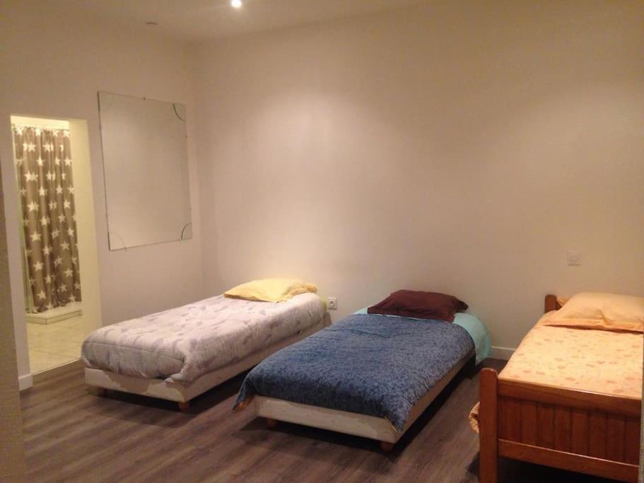 Appartement au calme tesisinde bir odada yatak veya yataklar