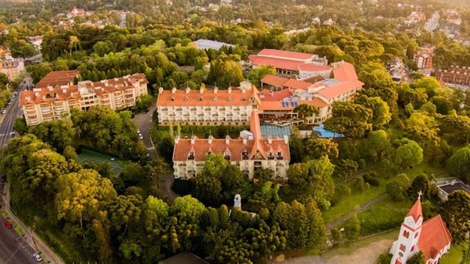 an aerial view of a large building with trees at Wish Serrano Resort in Gramado