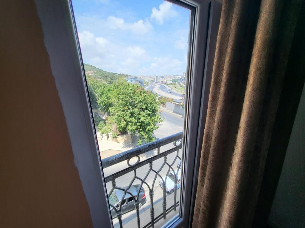 a window in a room with a view of a street at Venera Hotel in Baku