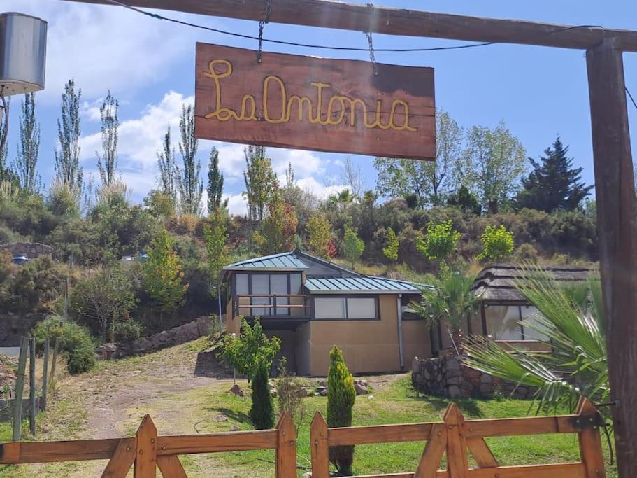 a sign for a house in a yard at La Antonia, cabaña al pie de la montaña in Ciudad Lujan de Cuyo