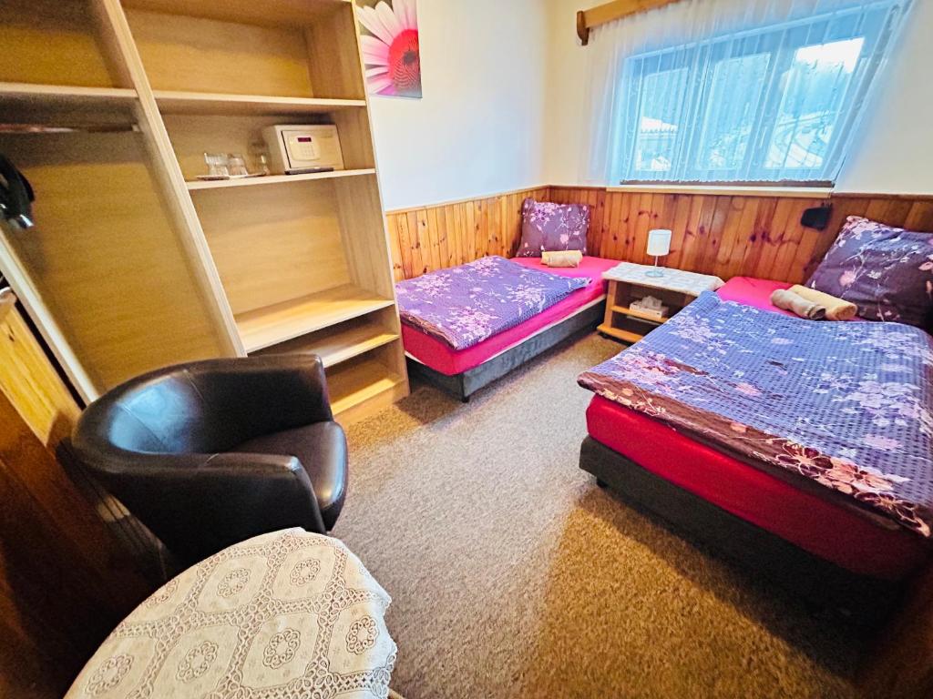 Postel nebo postele na pokoji v ubytování Penzion Chaloupka