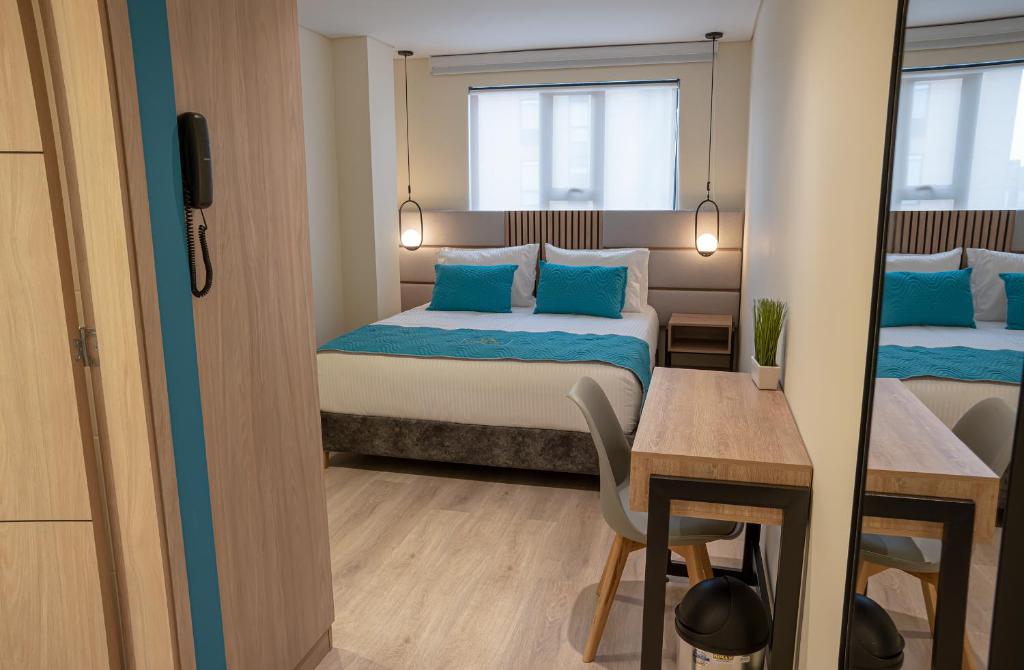 Postel nebo postele na pokoji v ubytování Hotel Fontana Bogotá - Corferias