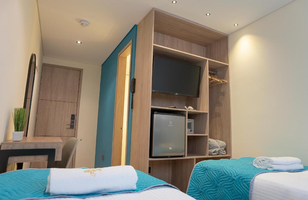 Postel nebo postele na pokoji v ubytování Hotel Fontana Bogotá - Corferias