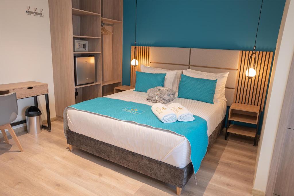 Postel nebo postele na pokoji v ubytování Hotel Fontana Bogotá - Corferias