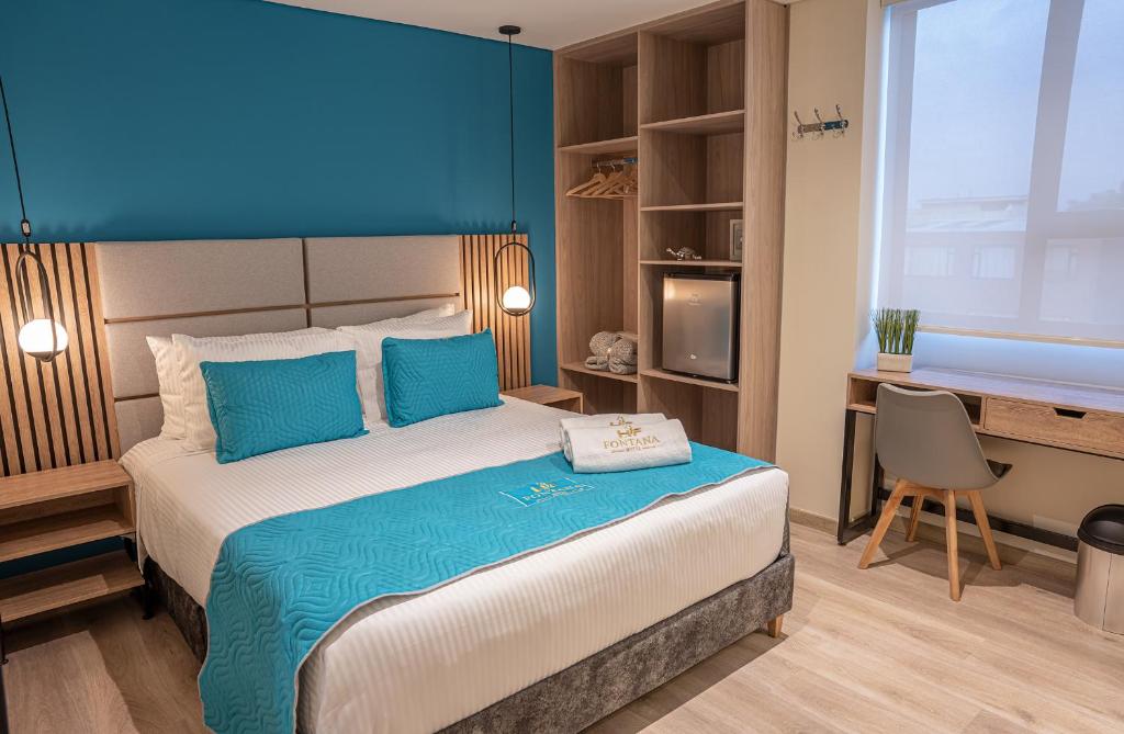 Postel nebo postele na pokoji v ubytování Hotel Fontana Bogotá - Corferias