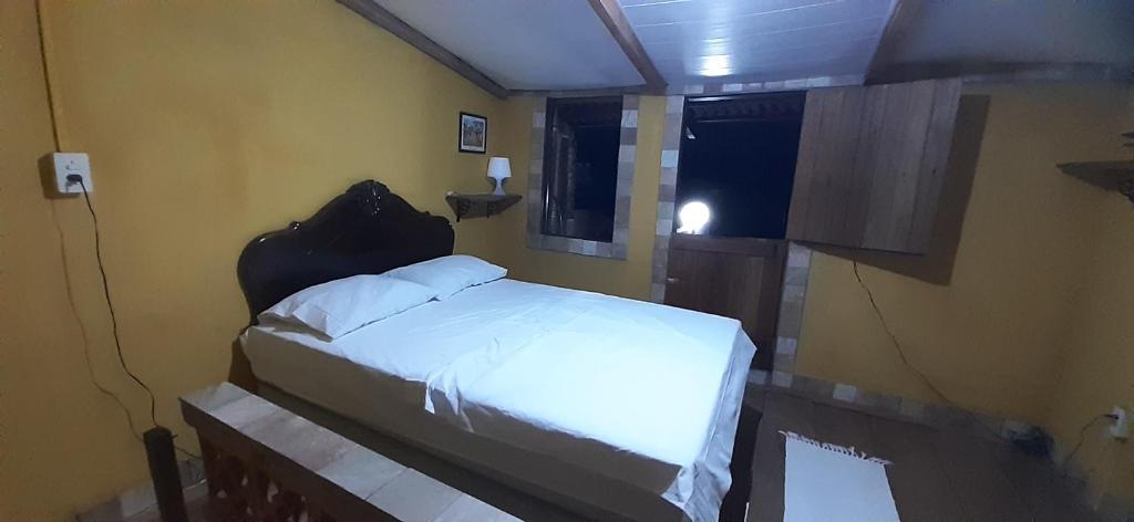 Postel nebo postele na pokoji v ubytování ROSÁRIO TEMPORADA Hostel