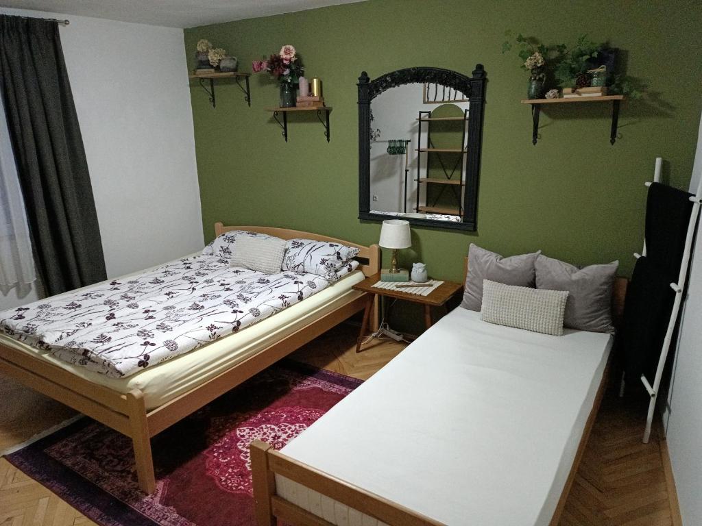 Posteľ alebo postele v izbe v ubytovaní Apartman Ohren
