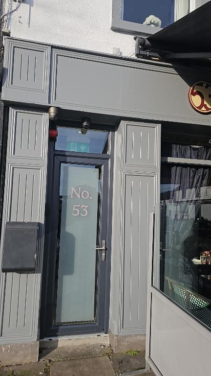 a door to a store with a no sign on it at B53 Accommodation in Maynooth