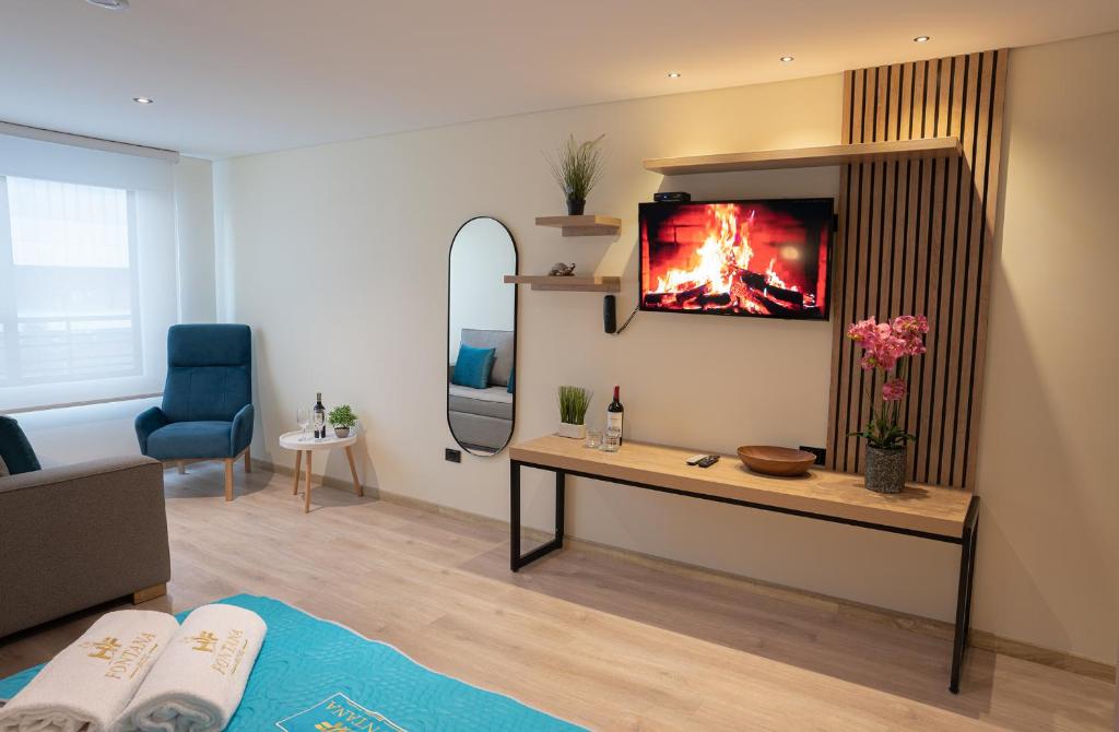 TV a/nebo společenská místnost v ubytování Hotel Fontana Bogotá - Corferias