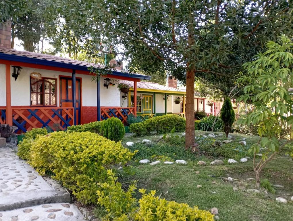 a garden in front of a house at Truchera San José in Belmira