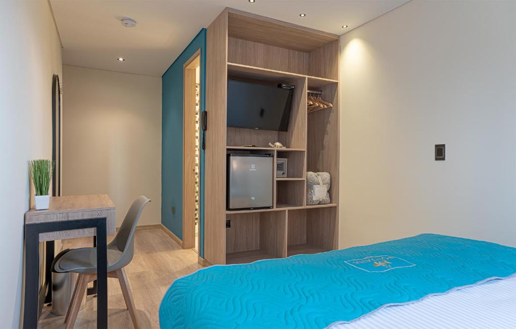 Postel nebo postele na pokoji v ubytování Hotel Fontana Bogotá - Corferias