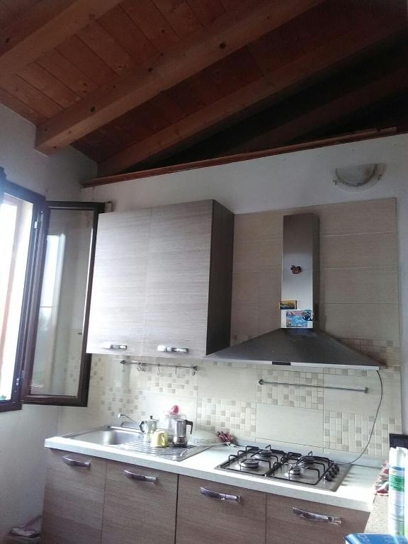 Kuchyň nebo kuchyňský kout v ubytování B&B Le Palme d'Oro