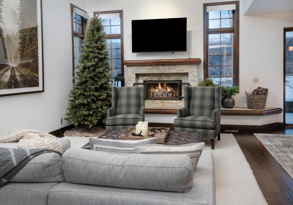 a living room with a couch and a christmas tree at Wildflower Place Unit 5 in Edwards