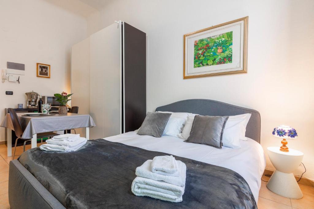 Posteľ alebo postele v izbe v ubytovaní Deluxe studio Milano