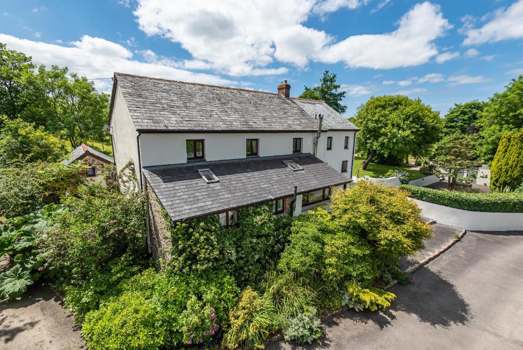 an overhead view of a white house at Waterland Farmhouse in Holsworthy