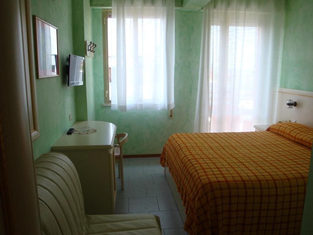 Postel nebo postele na pokoji v ubytování Hotel Prestigio