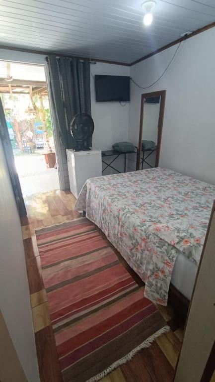 Cama ou camas em um quarto em Pousada Sobre as Ondas - ILHA DO MEL - PR