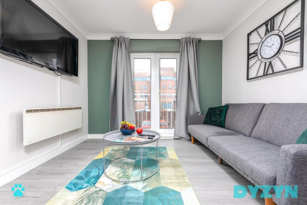 a living room with a couch and a table at WiFi | Parking | Comfort in Cardiff
