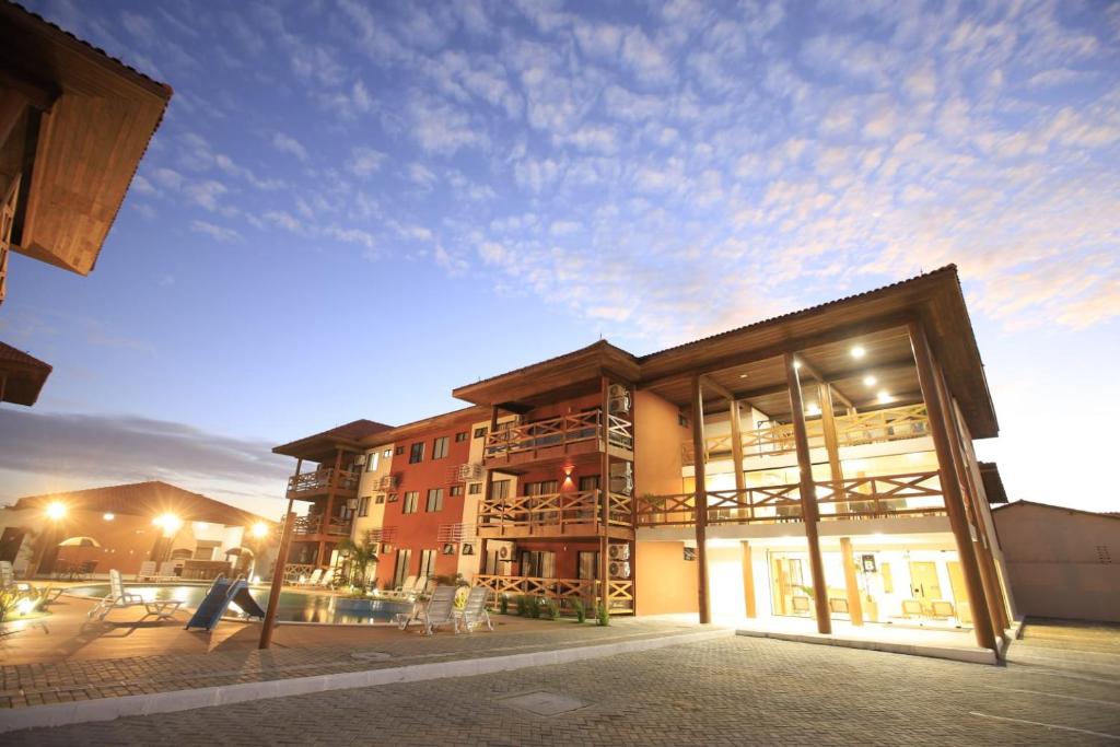 a man walking in front of a building at Vila Atlântida Beach in Luis Correia