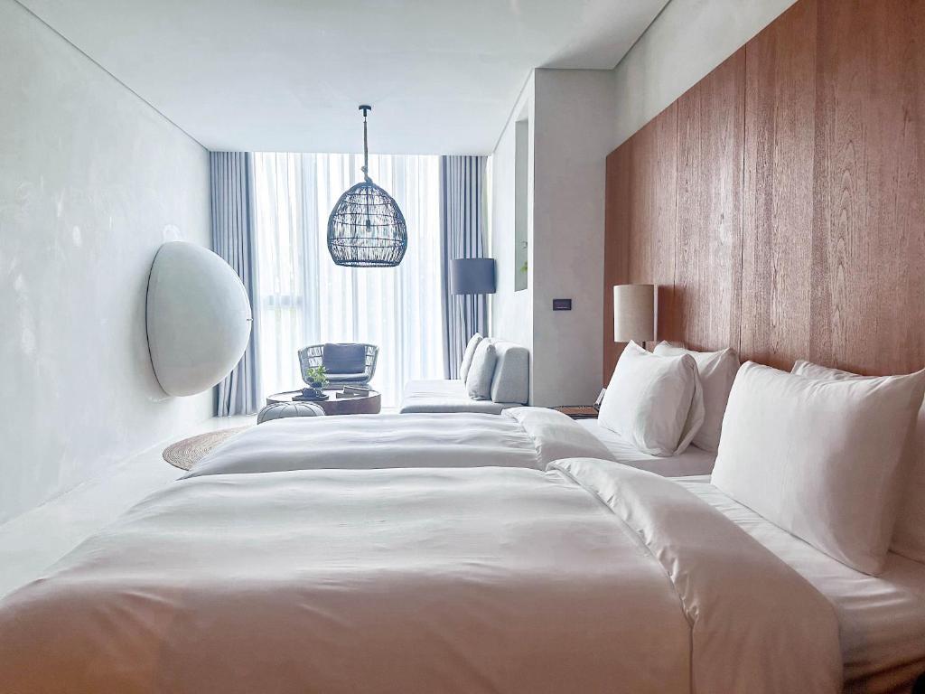 Postel nebo postele na pokoji v ubytování 了了礁溪 Vivir Jiaoxi Hotel