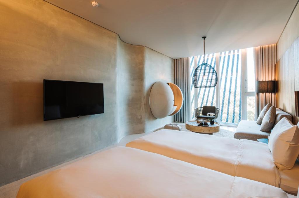 Postel nebo postele na pokoji v ubytování 了了礁溪 Vivir Jiaoxi Hotel
