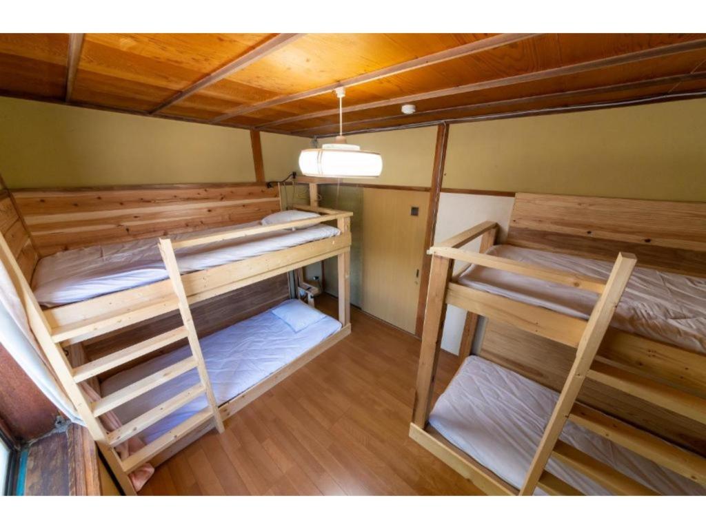 a group of bunk beds in a room at Showa No Toraya - Vacation STAY 61491v in Chikuma