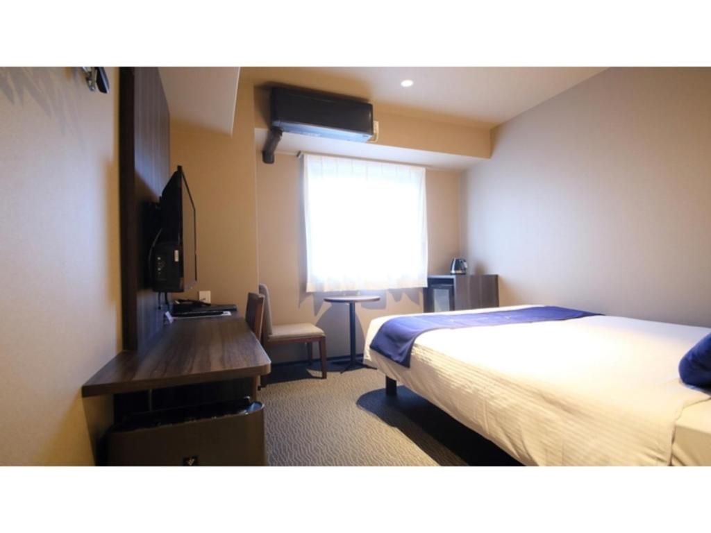 Un pat sau paturi într-o cameră la Dynasty Hotel Osaka - Vacation STAY 61689v