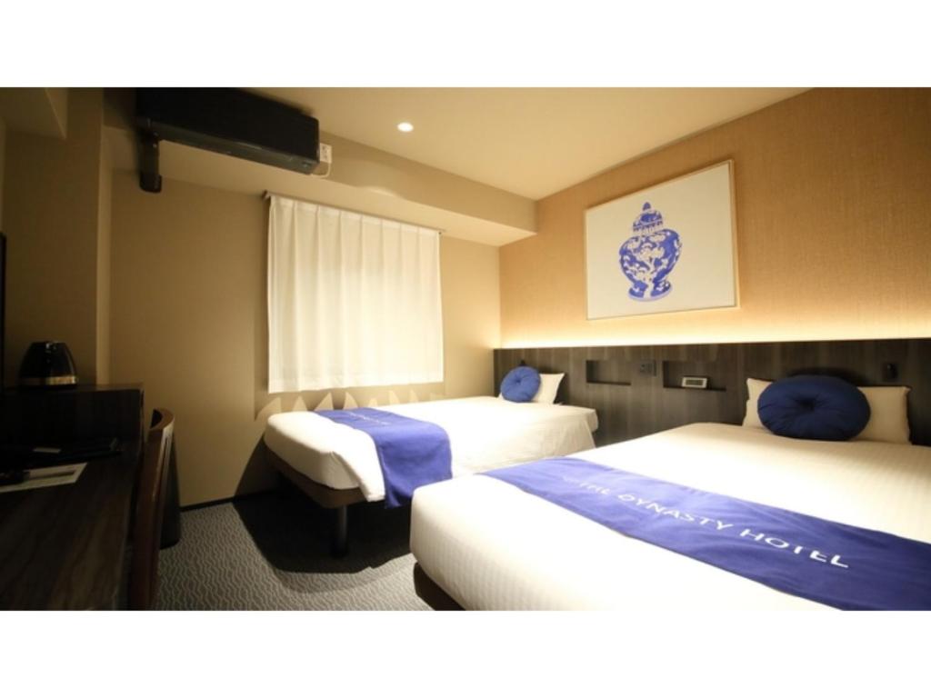 Krevet ili kreveti u jedinici u okviru objekta Dynasty Hotel Osaka - Vacation STAY 61768v