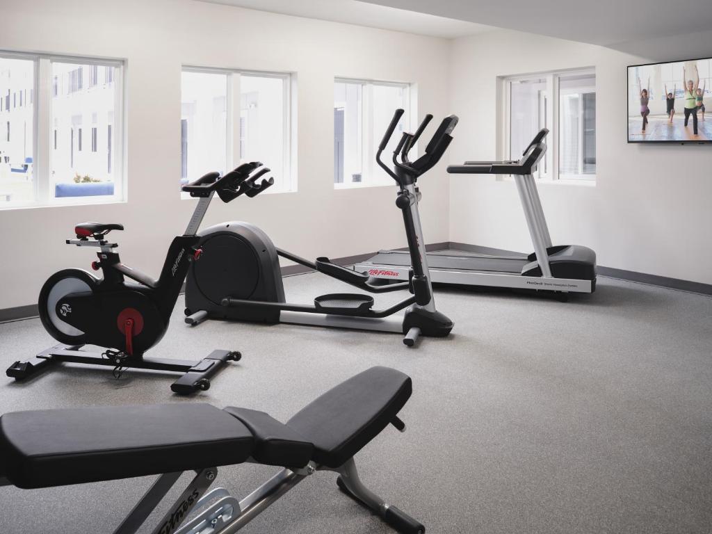 a gym with several exercise bikes and tread machines at stayAPT Suites Killeen-Fort Cavazos in Killeen