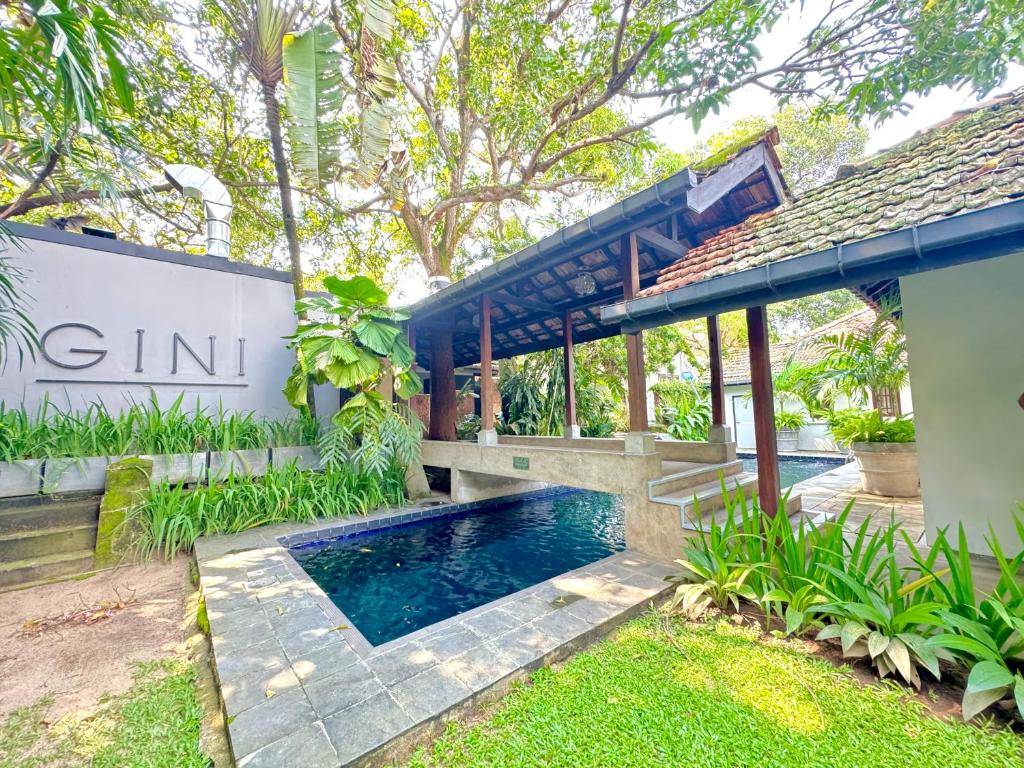 an external view of a villa with a swimming pool at Havelock Place Bungalow in Colombo