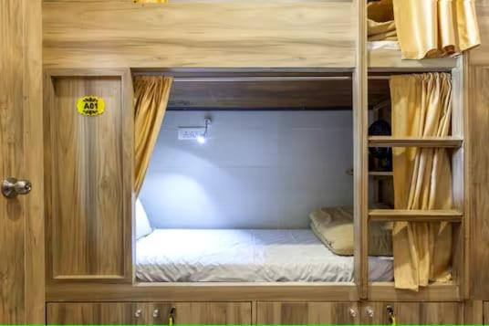 an open door to a bunk bed in a room at ABZA DELUXE DORMITORY in Mumbai