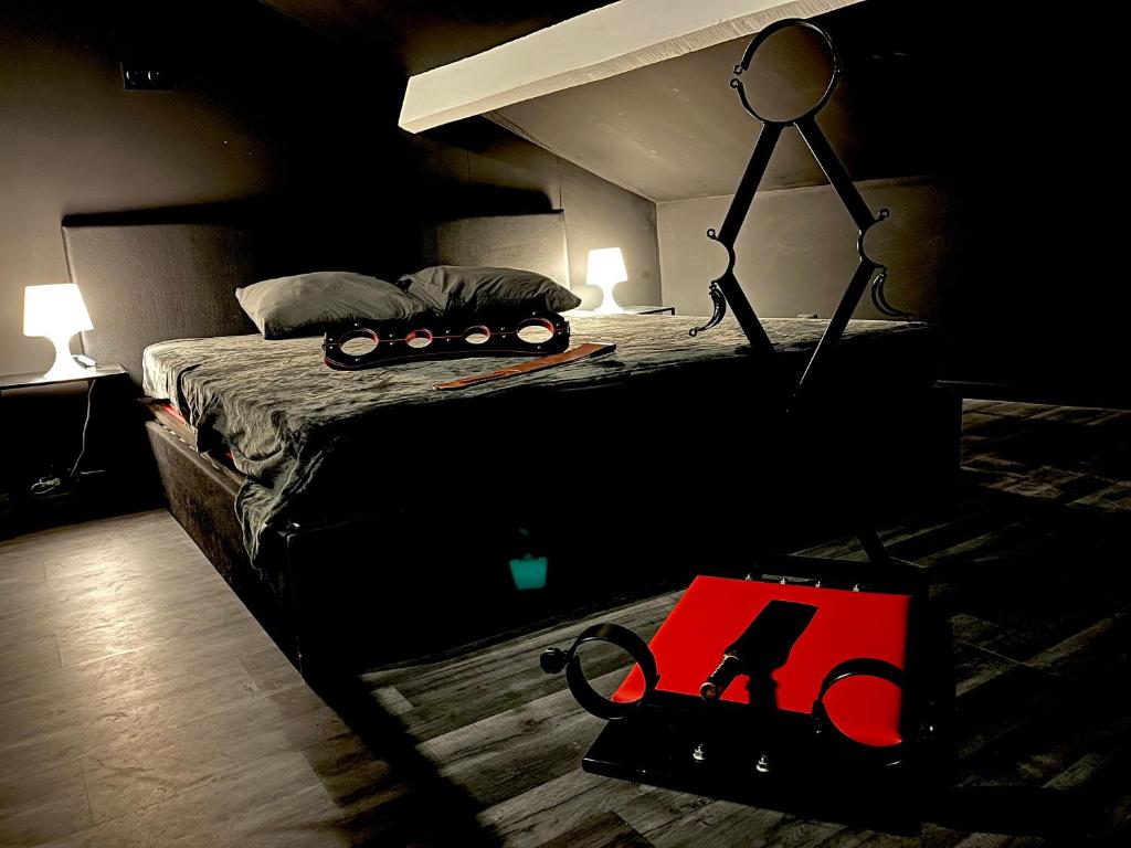 a bedroom with a bed with a toy train on it at Amour d&#39;une Nuit, LoveRoom in Sarcelles
