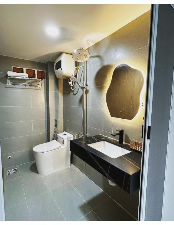 a bathroom with a sink and a toilet at December HomeStay Studio in Ho Chi Minh City