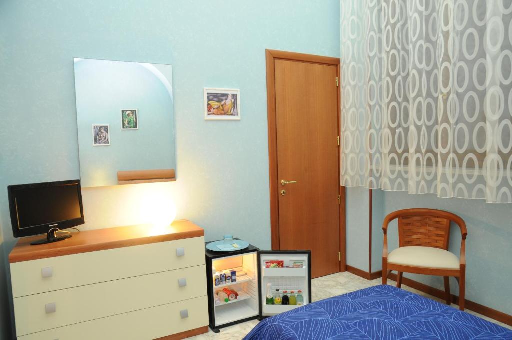 TV a/nebo společenská místnost v ubytování Affittacamere Conte Di Cavour