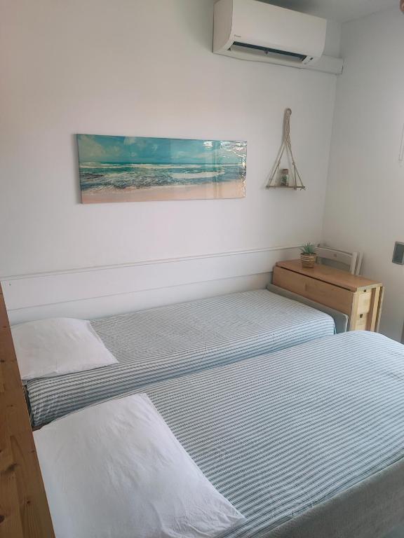Postel nebo postele na pokoji v ubytování Apartamento frente al mar