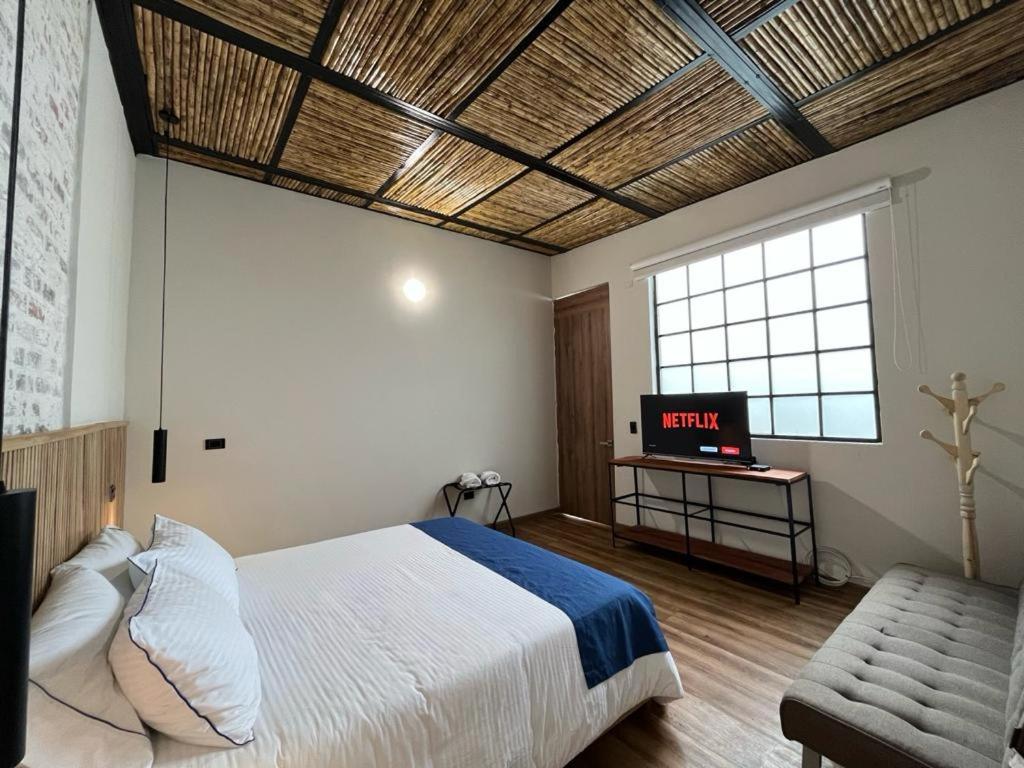 Postel nebo postele na pokoji v ubytování Casa 121, calle 121 no 7-18