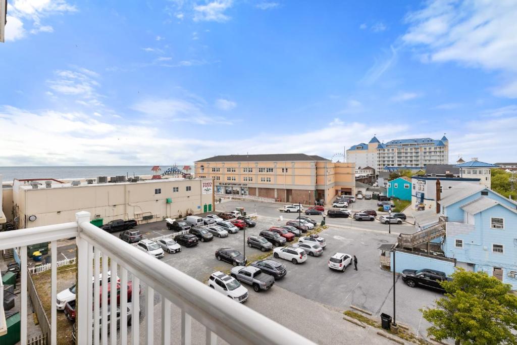a balcony view of a parking lot with cars at Beachview OC 2 Ocean Block in Ocean City